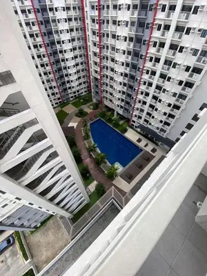 an overhead view of two tall buildings with a pool at 2 BR Fully Furnished Condo in Parañaque with Pool and Parking - Bloom Unit 1134 in Manila