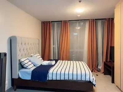 a bedroom with a bed in front of a window at BGC Luxe Condo I Facing Grand Hyatt & Uptown Mall in Manila