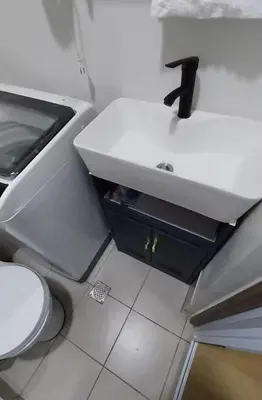 a bathroom with a sink and a toilet at MC Staycation at Spring Residences Near Airport in Manila