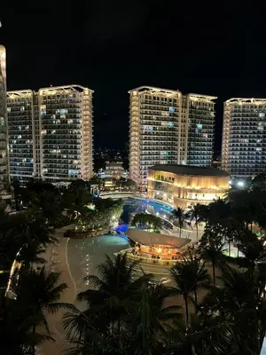 a view of a city at night with tall buildings at Azure Urban Resort Residences in Manila