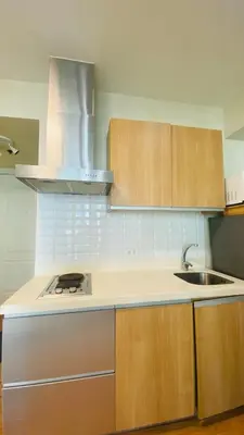 an empty kitchen with a sink and a stove at Azure Urban Resort Residences in Manila