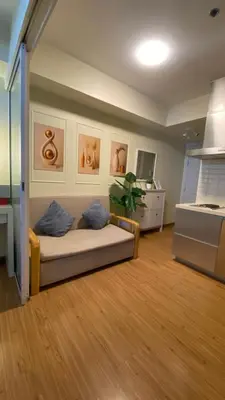 a living room with a couch in a room at Azure Urban Resort Residences in Manila