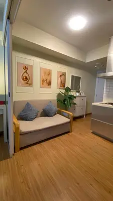 a living room with a couch in a room at Azure Urban Resort Residences in Manila