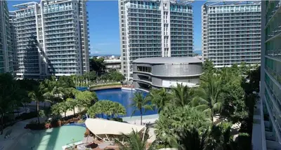 an overhead view of a resort with a pool and buildings at Azure Resort Condo with Man-Made Beach Pool in Manila