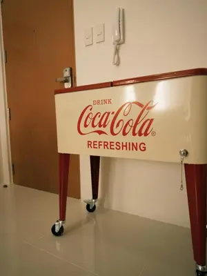 a coca cola sign in a room at One uptown Residence,BGC, Manila 1bedroom in Manila