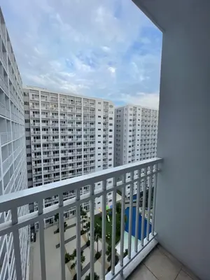 a balcony view of a large apartment building at City Point at Shore Residences in Manila