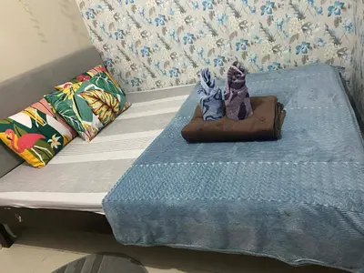 a bed with two figurines sitting on top of it at Budget Friendly Staycation -Ualat in Manila
