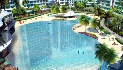 an overhead view of a large swimming pool with people in it at AZURE RESIDENCES near International AIRPORT MANILA in Manila