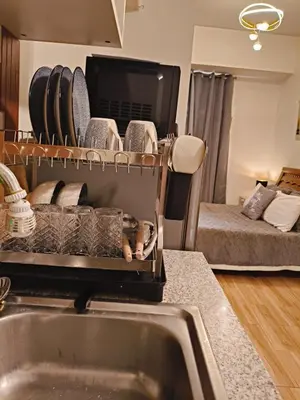 a kitchen with a sink and a counter top at Holland Park staycation in Jalang