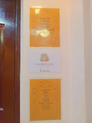 a wall with three framed pictures on a wall at Gabrielle Staycation in Imus