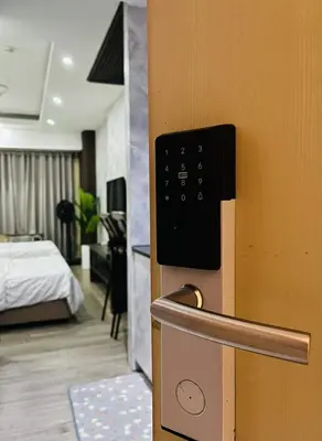 a room with a room with a bed and a door at Staycation in Pasay in Manila