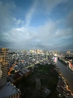 a view of a city with a river and buildings at Modern Condo in Makati with Stylish City Escape in Manila