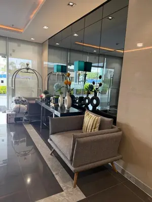 a living room with a couch and a table at Park Residences 201 - Sta Rosa Laguna