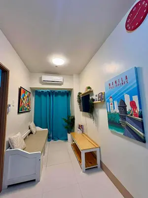 a living room with a couch and a table at D'Annes Holistay in Manila