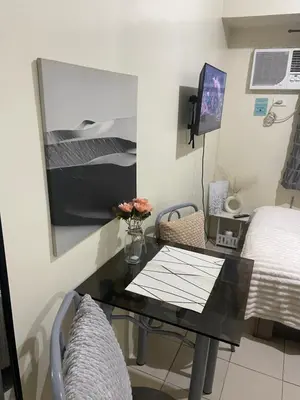 a hospital room with a table and a bed at The Cozy Nook in Manila