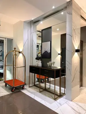 a dressing room with a desk and a mirror at Casa Doña at Kasara Urban Resort Residences in Manila