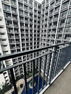 a balcony view of a large apartment building at The Baylight Escape at Shore 2 in Manila
