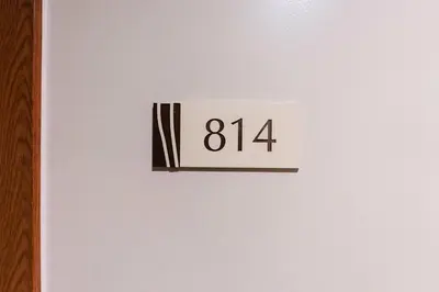 a white door with the number on it at shell residences condo walk to Mall of Asia in Manila