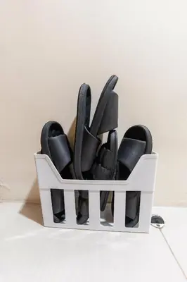 a white container filled with black kitchen utensils at shell residences condo walk to Mall of Asia in Manila