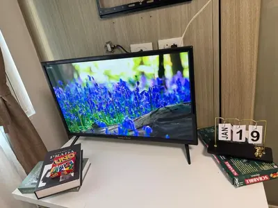 a flat screen tv sitting on top of a table at City Elite Retreats at Shore in Manila