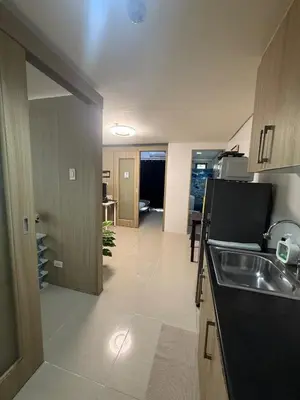 a kitchen with a sink and a counter top at City Elite Retreats at Shore in Manila