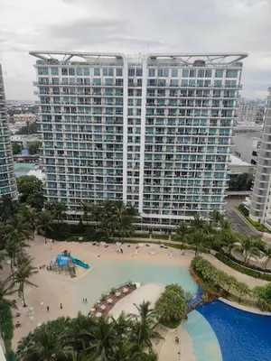 an aerial view of a large building with a beach at Azure Urban Resort residence's Staycation by angkol limo in Manila