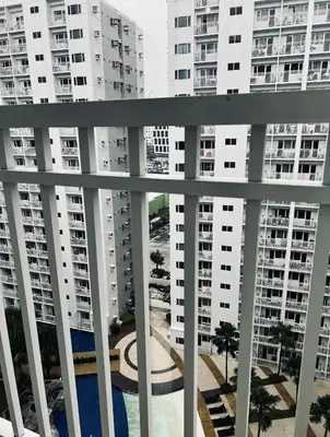 a view of some apartment buildings from a balcony at The Tropical Haven at Shore in Manila