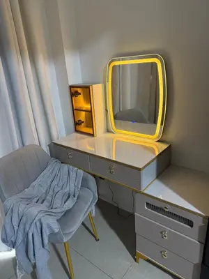 a dressing table with a mirror and a chair at The Tropical Haven at Shore in Manila