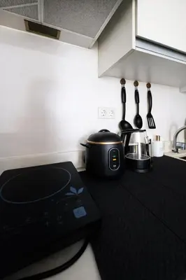 a kitchen with a counter top with a slow cooker at Calme Corner Azure Urban Residences Maldives Tower in Manila
