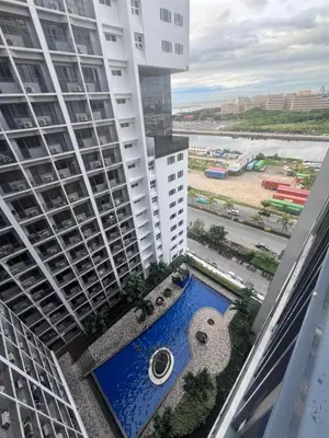 a view from the balcony of a building with a swimming pool at Le Trevi Suite at MOA Pasay Staycation in Manila