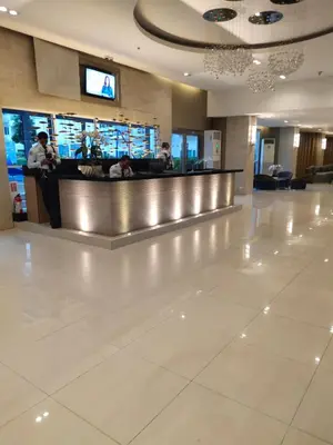 a lobby of a hotel with a bar in it at NEAR SMX, MOA Sea Residence Condotel in Manila