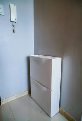 a white refrigerator in a corner of a room at Spacious 1-BR Condo near BGC w Pool and Gym in Manila