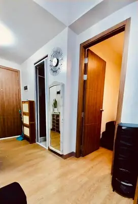 an empty living room with a mirror and a door at MCStaycation at Spring Residence Near Airport in Manila