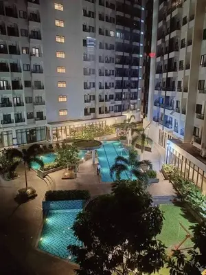 an overhead view of a large apartment building with a pool at MCStaycation at Spring Residence Near Airport in Manila