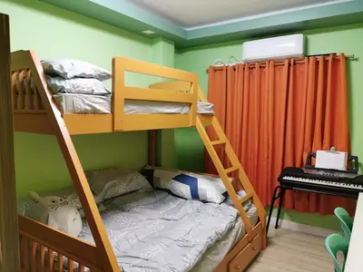 a bedroom with two bunk beds and a piano at Private Room Casa de los Reyes Kings' HouseHomestay in San Pedro