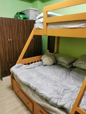 a bunk bed with a stuffed animal sitting on the bottom bunk at Private Room Casa de los Reyes Kings' HouseHomestay in San Pedro