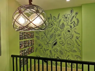 a wall with a mural of flowers on a green wall at Private Room Casa de los Reyes Kings' HouseHomestay in San Pedro