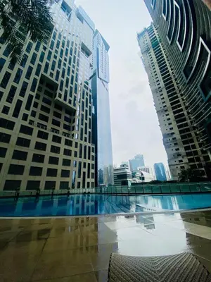 a view of a city skyline with tall buildings at Designer Pad Town with Free Pool, Gym and Smart TV and Fast Wifi in Manila