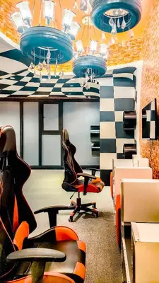 an office with a chair and a desk and a table at Designer Pad Town with Free Pool, Gym and Smart TV and Fast Wifi in Manila