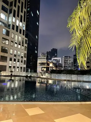 a large pool of water in a city with buildings at Poblacion Makati with Pool, Gym, Jacuzzi, Pool Table and fast wifi in Manila