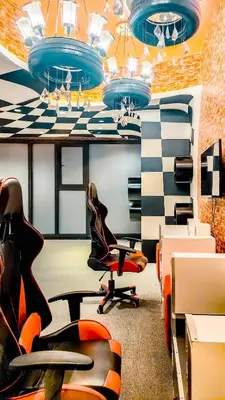 an office with a chair and a desk and a table at Poblacion Makati with Pool, Gym, Jacuzzi, Pool Table and fast wifi in Manila