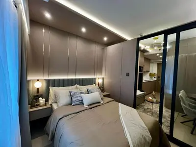a bedroom with a large bed in a room at Harbor Calm Suite in Manila