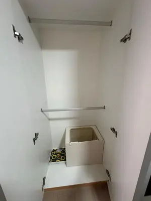 a white room with a box on a shelf at Uptown Home 1BR at One Uptown Residence BGC in Manila