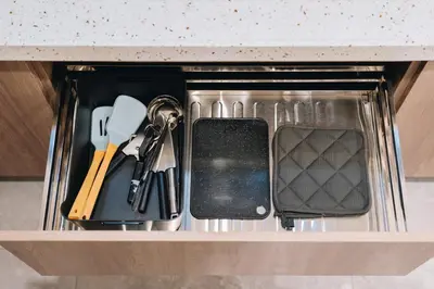 a drawer with keys and other items in it at Dragon's Keep BNB near NAIA and MOA in Manila