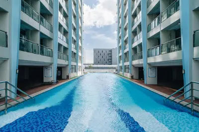 an empty swimming pool in the middle of a building at Dragon's Keep BNB near NAIA and MOA in Manila