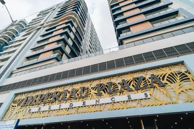 a hotel sign on the front of a building at Dragon's Keep BNB near NAIA and MOA in Manila