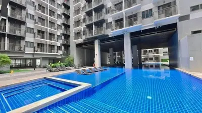 a swimming pool in the middle of a building at Hidden All in Comfy Luxe Stay MOA Pasay in Manila