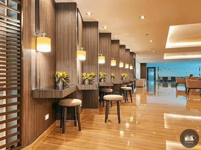 a lobby with a row of bar stools at Makati Staycation by Jing in Manila