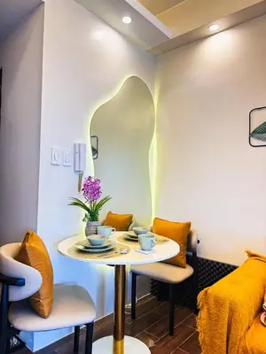 a dining room with a table and chairs at Makati Staycation by Jing in Manila