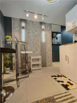 a living room with a room with at Antel Spa & Serenity Suites by Yyess in Manila